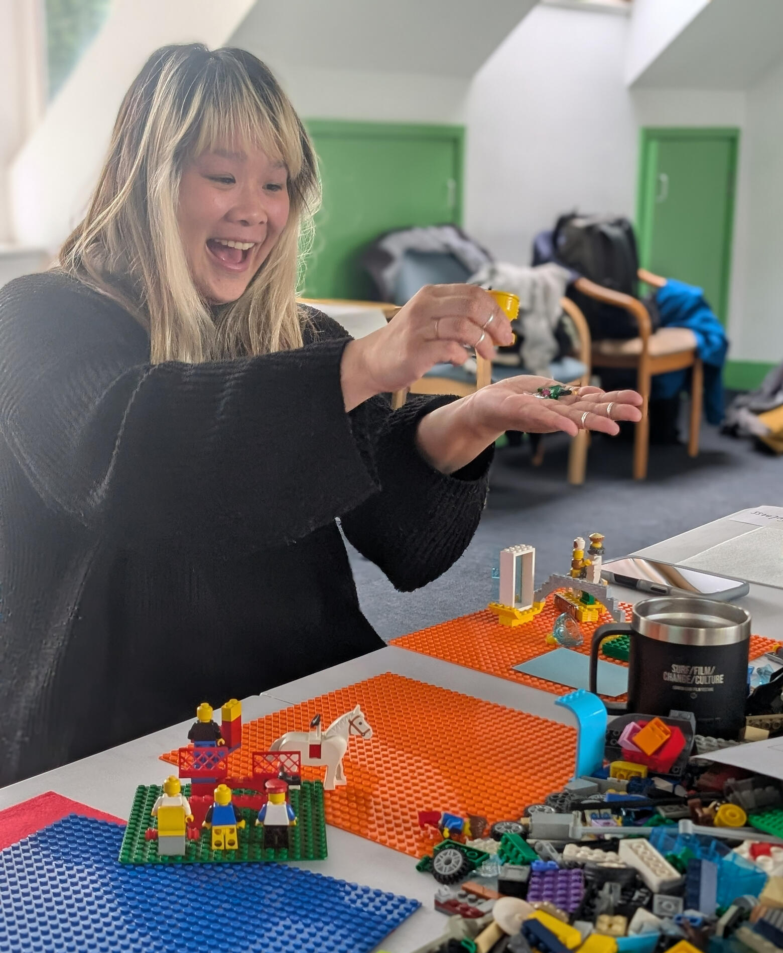 Woman delighted at Climate Play LEGO Serious Play workshop